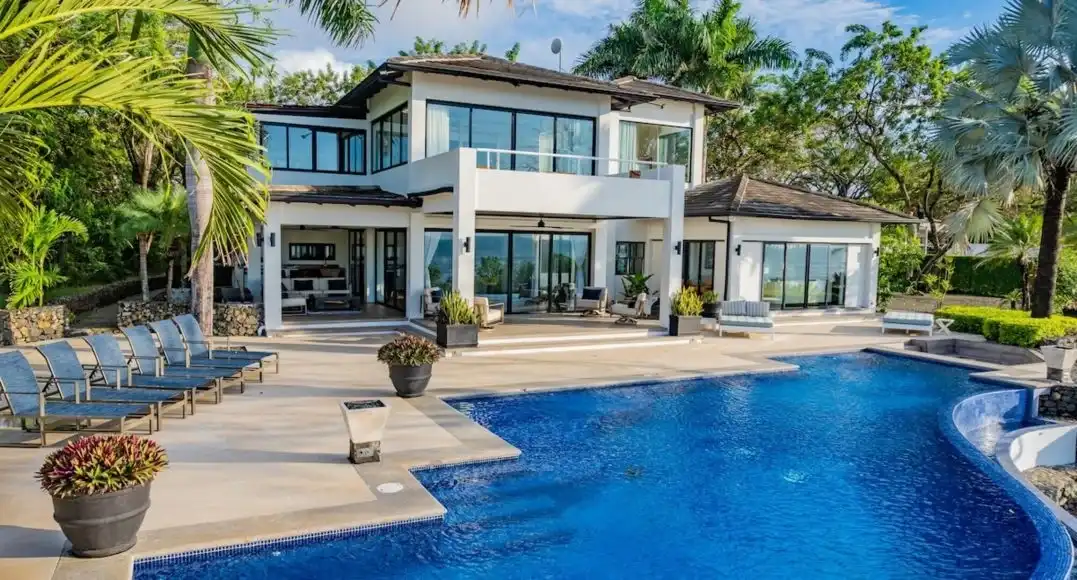 Beachfront villa in Costa Rica with infinity pool and private steps leading to the ocean.